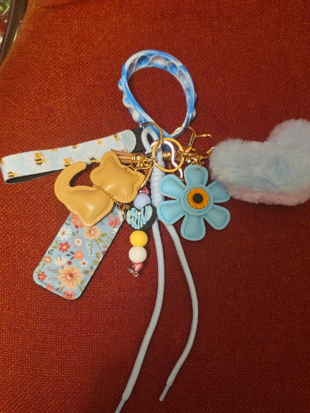Plush Pink Pom-Pom Bag Charm with Blue Flower Charm